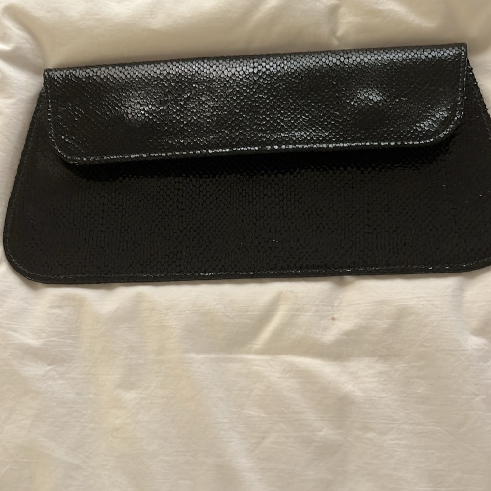 Vintage Elegant, textured, shiny black leather clutch.